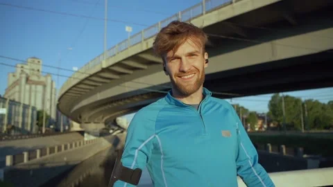 Smiling athlete looking at camera outdoors Stock Footage 134449939
