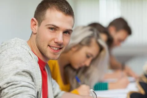 Smiling attractive student looking at camera Fotos Stock