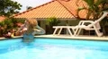 Smiling Attractive Woman Speaking on the Cell Phone in Swimming Pool. HD Footage