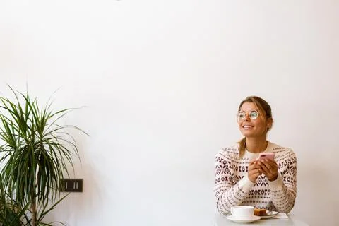 Smiling attractive woman using mobile phone Stock Photos