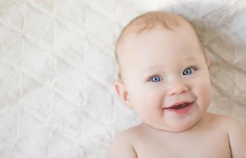 Smiling baby girl face Stock Photos