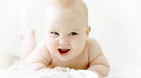 Smiling baby on the light background Stock Footage