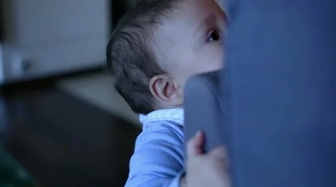 Smiling baby near a sofa  Stock Footage 61925448