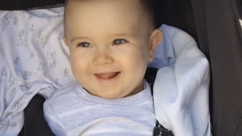 Smiling Baby in a stroller Stock Footage 91113386