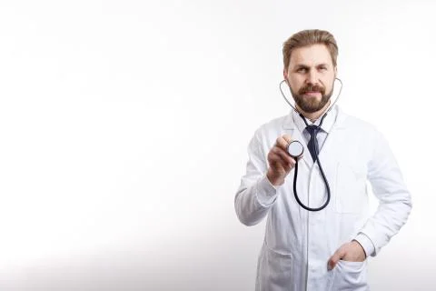 Smiling Bearded MD Posing With Stethoscope to Auscultate Stock Photos