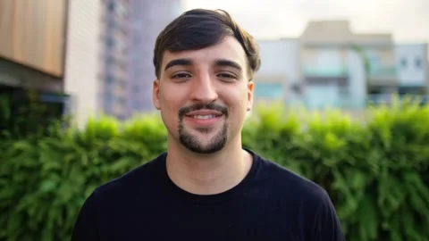 Smiling bearded young man looking at camera. Happy confident young adult. Stock Footage 265197032