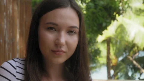 Smiling beautiful girl looking at the camera Stock Footage 138014641