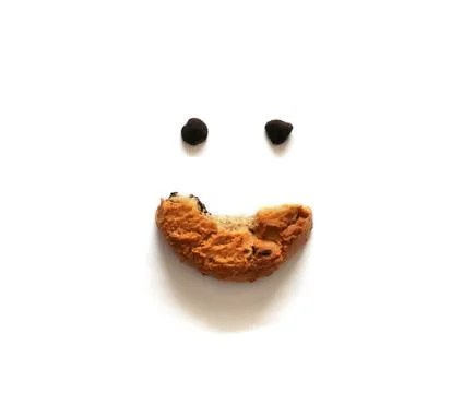 Smiling bitten cookie isolated on white background. Stock Photos