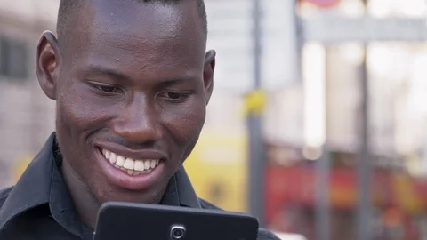 Smiling black american man using digital tablet outdoor-technology,communication Stock Footage 95773784