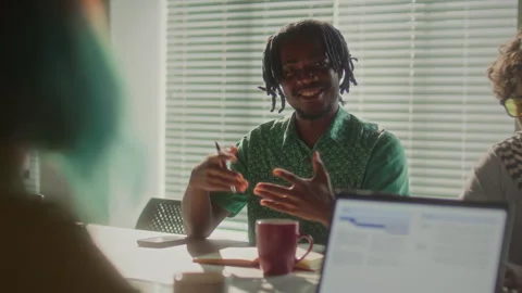 Smiling Black Businessman Explaining Ideas during Team Meeting in Office Stock Footage 340488694