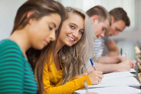 Smiling blonde student looking at camera Photos