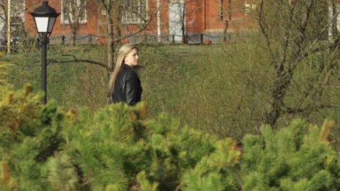 Smiling blonde is taking a walk Stock Footage 91072201