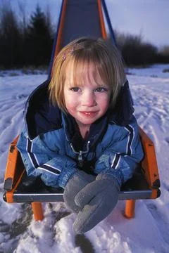 Smiling On The Bottom Of A Slide Stock Photos