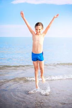 Smiling boy on the beach Stock Photos