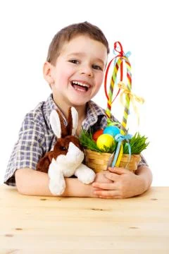 Smiling boy with easter eggs and bunny Stock Photos