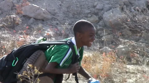 Smiling boy hikes with backpack. Video stock 27739323