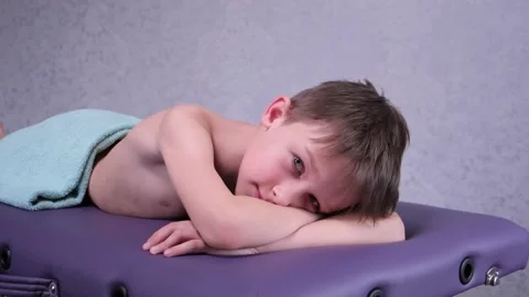 Smiling boy lying on the massage table. Stock Footage 152617652