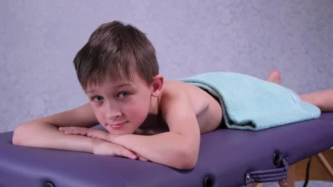 Smiling boy lying on the massage table. Stock Footage 152617699
