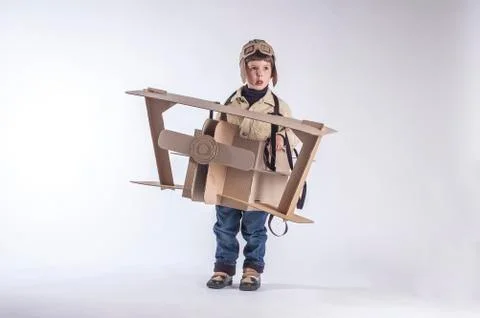 Smiling boy with plane Stock Photos
