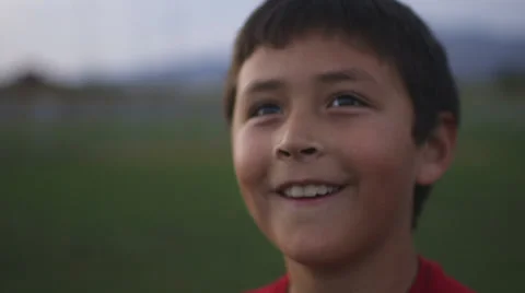 Smiling boy plays with remote control Stock Footage 37408493