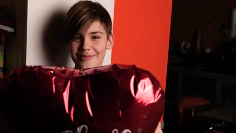 Smiling boy with red heart shaped balloon Stock Footage 146026045