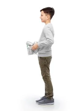 Smiling boy sorting metallic waste Stock Photos