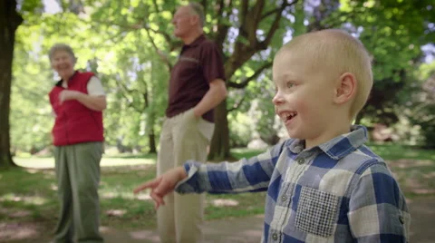Smiling boy standing in park Stock Footage 64453509