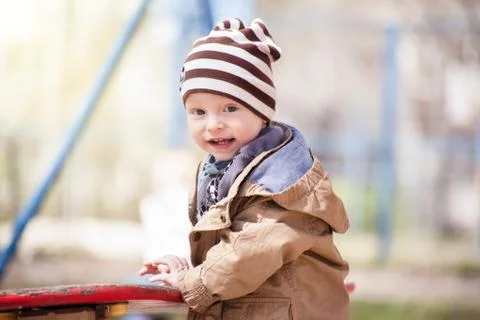 Smiling boy in striped hat Stock Photos