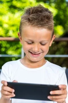 Smiling boy with tablet Stock Photos