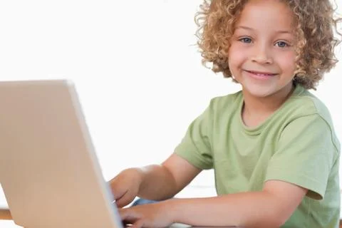 Smiling boy using a notebook 写真素材