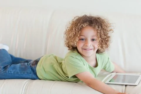 Smiling boy using a tablet computer 스톡 사진