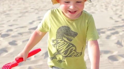 Smiling Boy Walking on the Beach Stock Footage 62420953