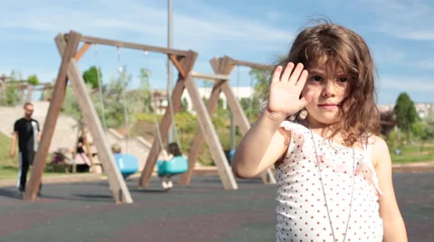 Smiling boy waving at Stock Footage 65847374
