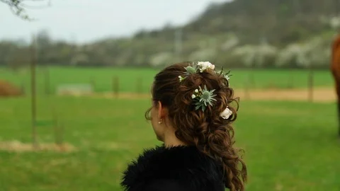 Smiling bride before wedding while preparing hair stylist outdoors Stock Footage 107659608