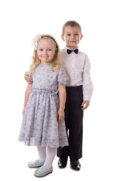 Smiling brother and sister standing together Stock Photos