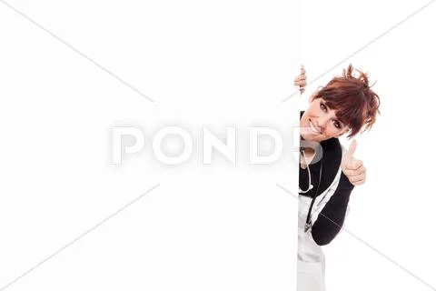 Smiling brunette female doctor with message board Stock Photos