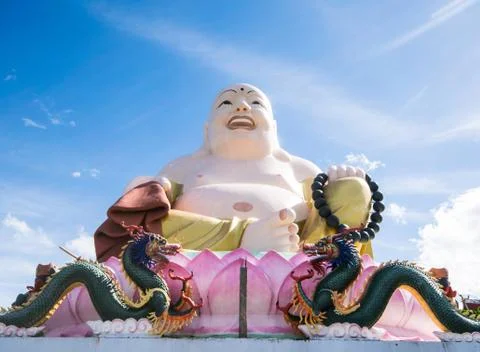 Smiling Buddha statue. Stock Photos