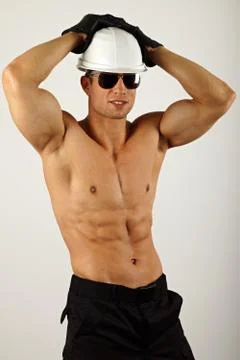 Smiling builder in a helmet Stock Photos