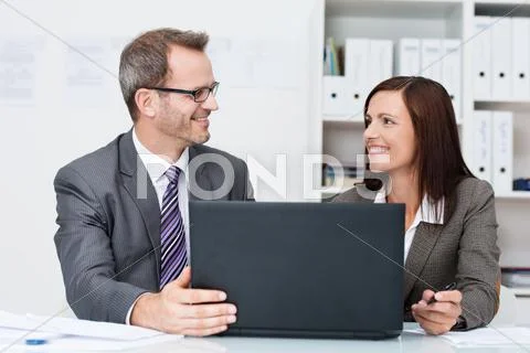 Smiling business colleagues in the office Stock-Fotos