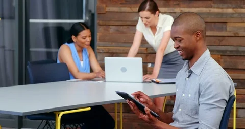 Smiling business executive using digital tablet Stock Footage