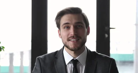 Smiling business man coach talking to camera during online training Stock Footage 132053865