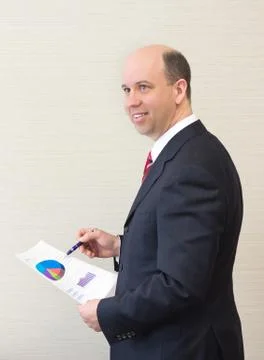 Smiling business man with document. Stock Photos