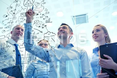 Smiling business people with marker and stickers Stock Photos