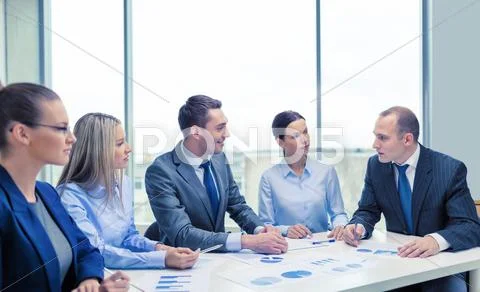 Smiling business team at meeting Stock Photos