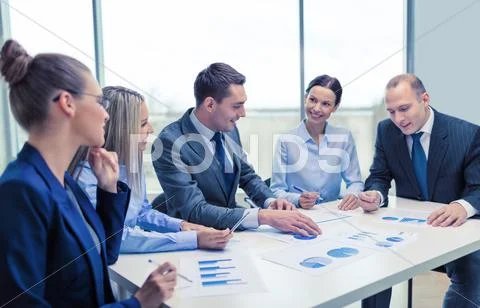 Smiling business team at meeting Stock Photos