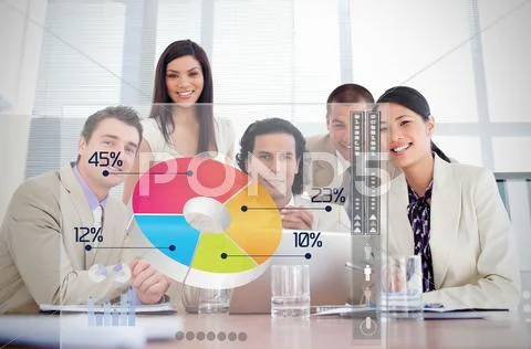 Smiling business workers looking at colorful pie chart interface Stock Photos