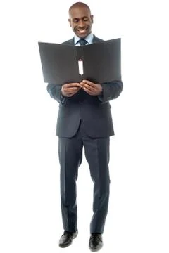 Smiling businessman with folder Stock Photos