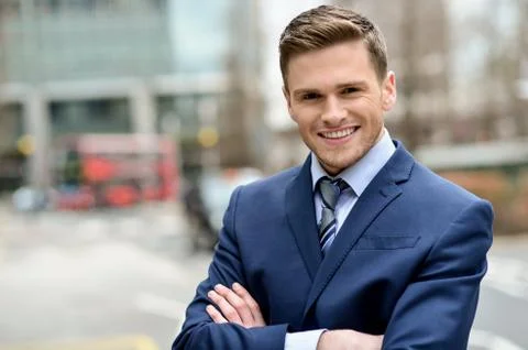 Smiling businessman posing for the camera Stock Photos