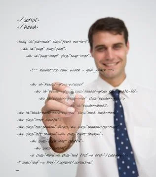 Smiling businessman writing in sql language Stock Photos