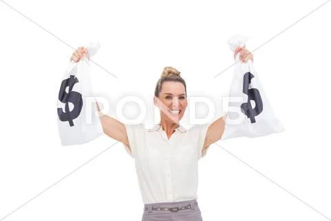Smiling businesswoman carrying money bags Stock-Fotos